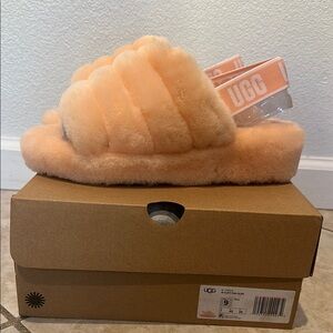 New Cozy and stylish fluffy slide sandals on soft pink. Perfect for casual wear.